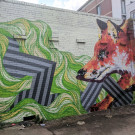 Wall mural featuring abstract shapes and a fox